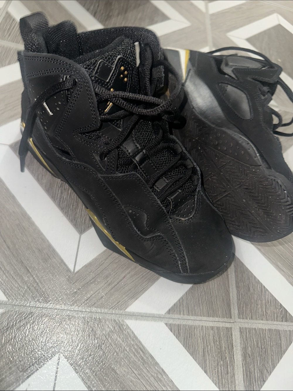 Jordan Black Sneakers with Gold Trim